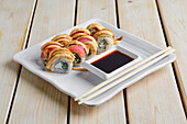 Sushi rolls with tuna and mustard sauce