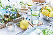 Spring table decorations with flowers and lemons