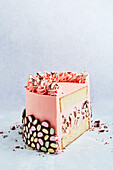 Pink layer cake with chocolate decoration