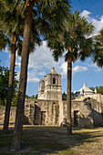 Palm trees and the Mission Concepcion in the San Antonio Missions National Historic Park, San Antonio, Texas. A UNESCO World Heritage Site.