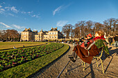 Visitors enjoy a sunny winter afternoon at the Luxembourg Palace and Gardens.
