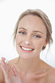 Smiling Woman with Moisturizing Cream on Nose