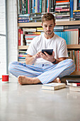 Man Using Digital Tablet at Home