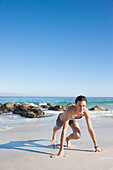 Woman Working Out on Beach