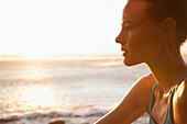 Backlit Profile of Woman by Sea