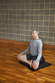 Mature Man Practicing Yoga, Easy pose