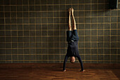 Mature Man Practicing Yoga, Handstand