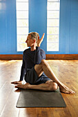 Mature Man Practicing Yoga, Half lord of the fishes pose