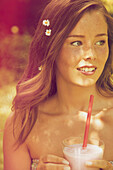 Young Woman Outdoors Drinking Smoothie