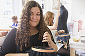 Portrait of Female Employee at Embroidery Design Studio