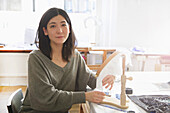 Portrait of Female Employee at Embroidery Design Studio