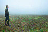 Man Standing in Field