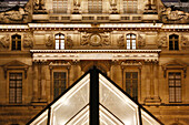 Paris. 1st district. Louvre Museum by night. One of the secondary pyramids (architect: Ieoh Ming Pei). In the background,the Sully Pavilion.Mandatory credit of the architect architect: Ieoh Ming Pei