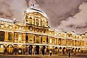 Paris. 1st district. Louvre Museum by night. Square courtyard. Facade of the clock pavilion.