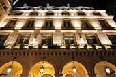 Paris. 1st district. Pyramids Square at night. Facade of the Regina Hotel.