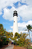 USA. Florida. Miami. Key Biscayne. Bill Baggs Cape Florida State Park. Lighthouse. Tourists visiting the park.