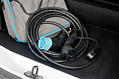 France. Seine et Marne. Electric car Renault Zoe. Close up on charging cable (type 2 and type 3) in the car trunk.