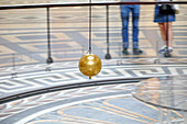 France. Paris. 5th district. The pantheon. The Foucault pendulum. Tourists in the background.