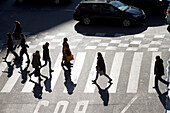 France,Paris,75,9th arrondissement,haussmanian boulevard pedestrians croosing the road,in iwnter