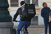 Meal delivery on bicycle. Uber Eats