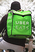 Meal delivery on bicycle. Uber Eats