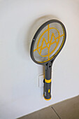 Electrified racket to hunt mosquitoes
