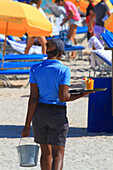 Usa,Florida,Miami,young woman waitress at the beach