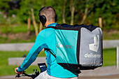 Europe,Nederlands. Deliveroo  bicycle delivery man