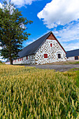 Europe,Scandinavia,Sweden,farmhouse with stone walls