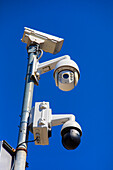 Surveillance camera in a blue sky