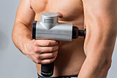 Muscle massage gun for muscle recovery and against muscle soreness