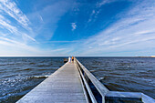 Europe,Scandinavia,Sweden. Halland county. Falkenberg. Morning swim on the pier