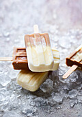 Cappuccino cream ice lolly on ice cubes