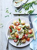 Potato and asparagus salad with poached egg