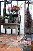 Christmas winter garden decorated with gifts and flower arrangements