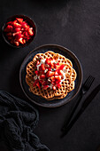 Waffles with whipped cream and strawberries