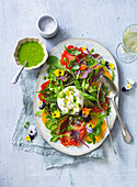 Summer salad with ox heart tomatoes and burrata