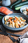 Braised cucumbers with salmon and dill