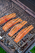 Salmon fillets in a grid on the grill