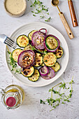 Grilled courgettes and onions with herbs