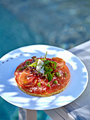 Tomato tartlet with lomo iberico and pistou