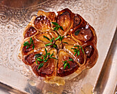 Baked garlic bulb with thyme and sea salt