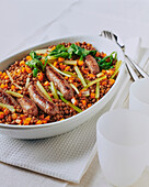 Lentils with lamb sausages and vegetables