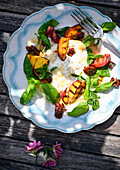 Burrata with honey, nuts and grilled peaches