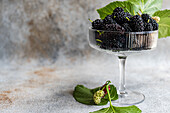 Fresh mulberries in a glass bowl