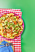 Buffalo chicken nachos with avocado