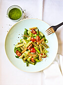 Pasta salad with vegetables and green sauce