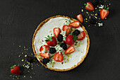 Mini no-bake cheesecake with strawberries, blackberries and elderflowers