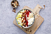Rice pudding bowl with apple pieces and nuts