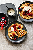 Oat waffles with berries and almond yoghurt